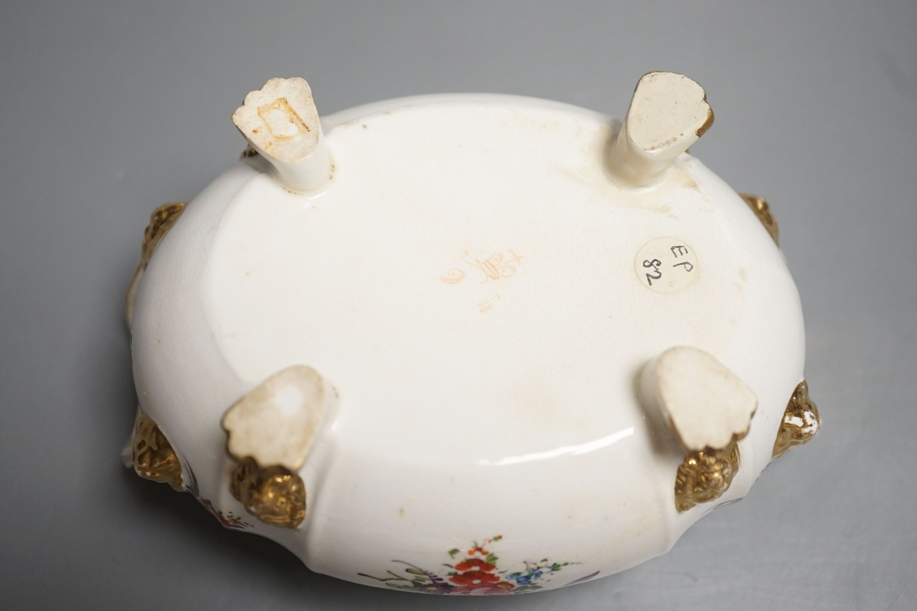 A Derby tureen and cover, early 19th century, on four feet with lion head masks painted with flowers, red mark, overall height 13.5cm